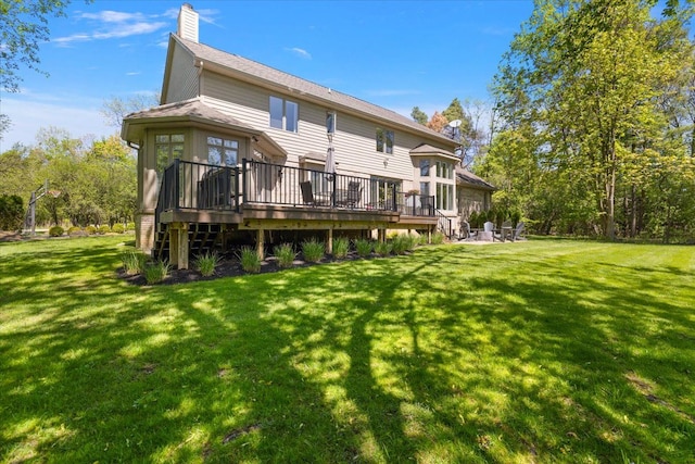 31080 Lucerne Dr, Franklin, MI 48025 - rear view of property with a deck, a chimney, a yard, and roof with shingles