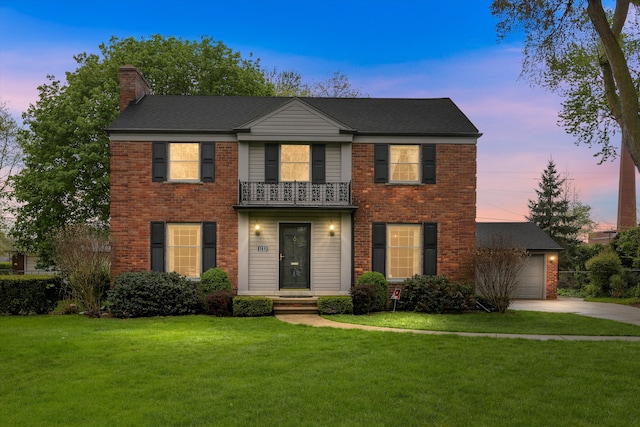 1133 Balfour St, Grosse Pointe Park, MI 48230 - view of front facade with a balcony, a chimney, driveway, and brick siding