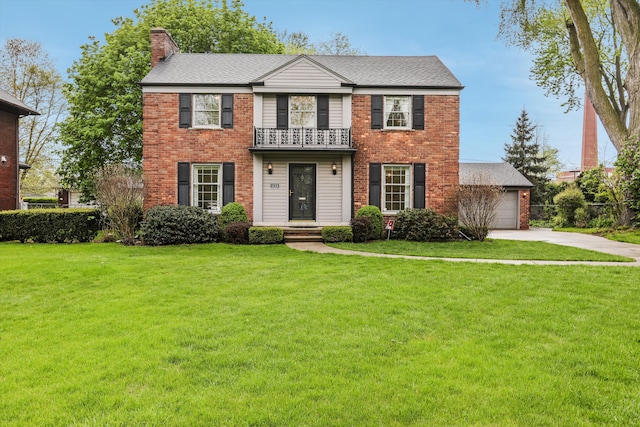 1133 Balfour St, Grosse Pointe Park, MI 48230 - view of front of house featuring a balcony, a chimney, brick siding, and a front lawn