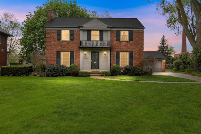 1133 Balfour St, Grosse Pointe Park, MI 48230 - view of front of house featuring a balcony, brick siding, a chimney, a lawn, and driveway