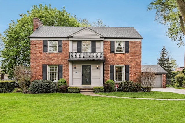 1133 Balfour St, Grosse Pointe Park, MI 48230 - view of front of house featuring a balcony, brick siding, a chimney, driveway, and a front lawn