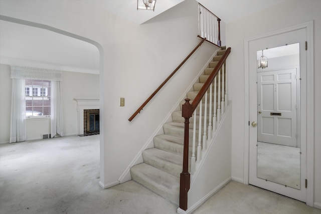 1133 Balfour St, Grosse Pointe Park, MI 48230 - stairway featuring carpet, a fireplace with flush hearth, and baseboards