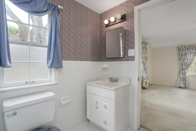 1133 Balfour St, Grosse Pointe Park, MI 48230 - bathroom with tile walls, toilet, vanity, wainscoting, and wallpapered walls