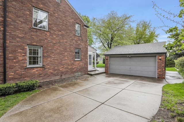 1133 Balfour St, Grosse Pointe Park, MI 48230 - view of side of home with an outdoor structure, brick siding, and a garage