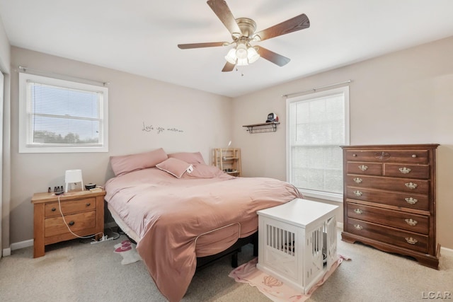 2924 E Valley Rd, Adrian, MI 49221 - bedroom with multiple windows, light colored carpet, and ceiling fan