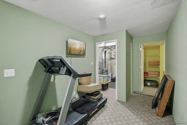 exercise room with carpet flooring