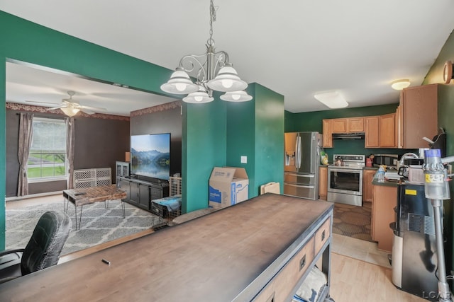 2924 E Valley Rd, Adrian, MI 49221 - kitchen with stainless steel appliances, under cabinet range hood, a chandelier, light wood-type flooring, and ceiling fan