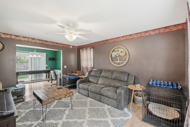 2924 E Valley Rd, Adrian, MI 49221 - living area with ceiling fan, a chandelier, and wood finished floors