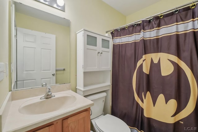 bathroom with vanity, toilet, and a shower with shower curtain
