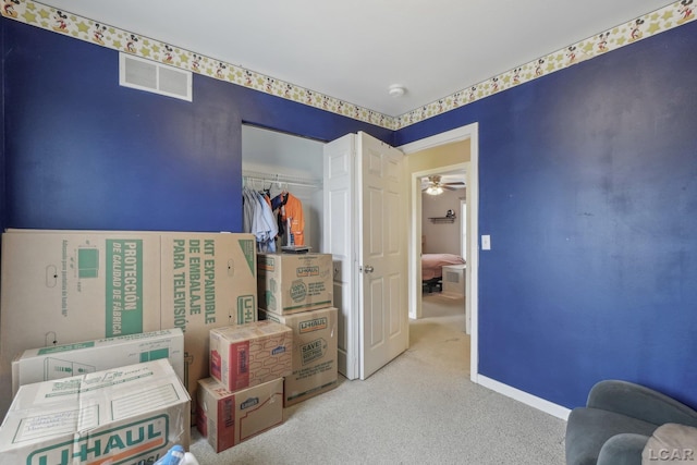 bedroom with carpet and a closet