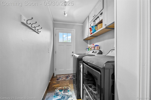 1162 Heights Rd, Lake Orion, MI 48362 - washroom with washer and clothes dryer, cabinet space, stone finish floors, baseboards, and ornamental molding