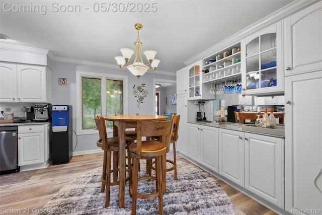 1162 Heights Rd, Lake Orion, MI 48362 - dining space with a chandelier, ornamental molding, light wood-type flooring, and baseboards