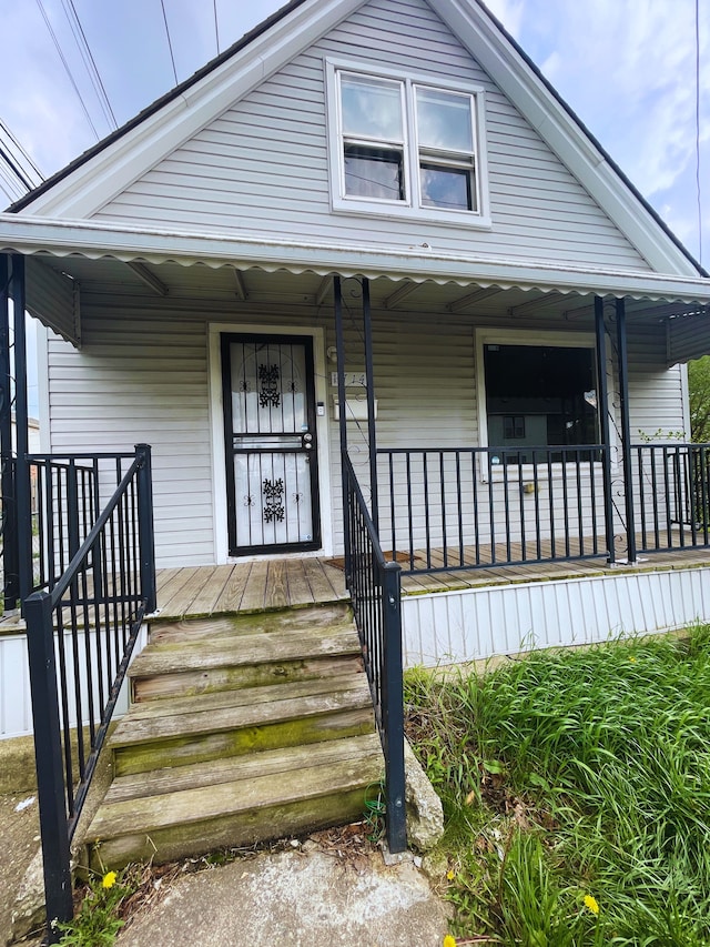 1714 Woodland St, Hamtramck, MI 48212 - view of front facade featuring covered porch