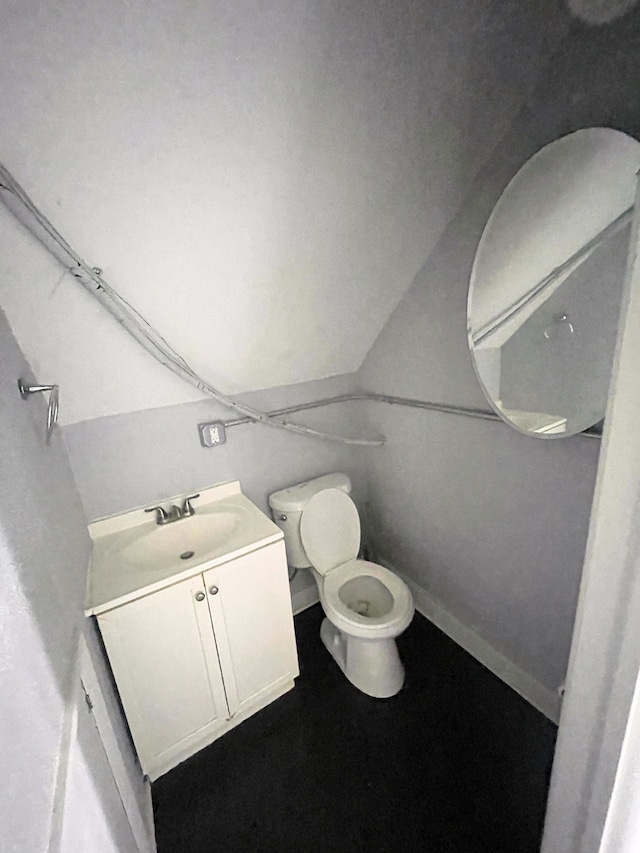 1714 Woodland St, Hamtramck, MI 48212 - bathroom with toilet, vanity, and baseboards