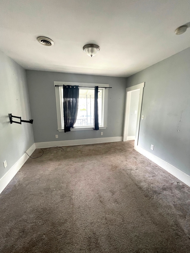 1714 Woodland St, Hamtramck, MI 48212 - carpeted spare room featuring baseboards