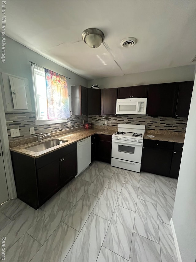 1714 Woodland St, Hamtramck, MI 48212 - kitchen featuring white appliances, light marble finish floors, tasteful backsplash, and electric panel