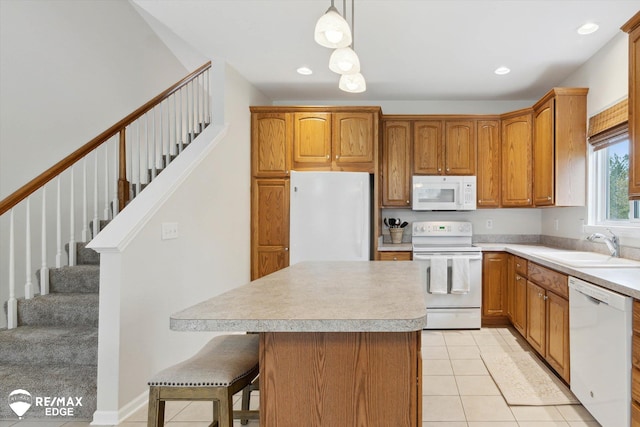4433 Sunset Blvd, Grand Blanc, MI 48439 - kitchen featuring white appliances, a sink, light countertops, light tile patterned floors, and a center island