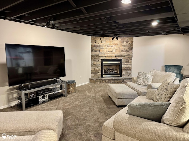 4433 Sunset Blvd, Grand Blanc, MI 48439 - carpeted living area with baseboards and a stone fireplace