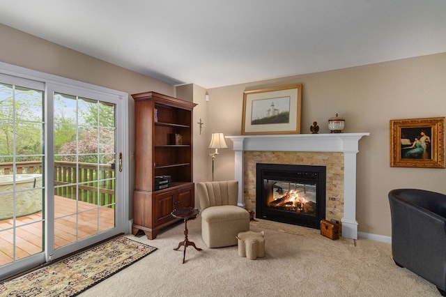 sitting room with light carpet and a multi sided fireplace