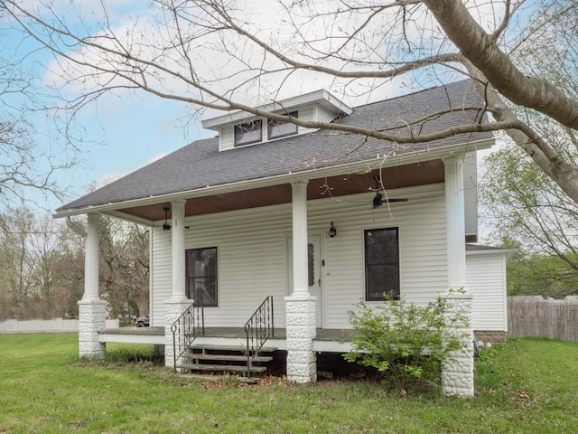 bungalow-style house featuring covered porch, roof with shingles, and ceiling fan