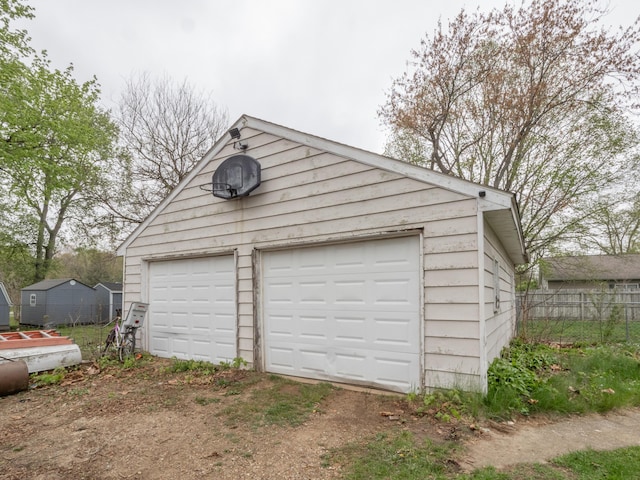 detached garage with fence