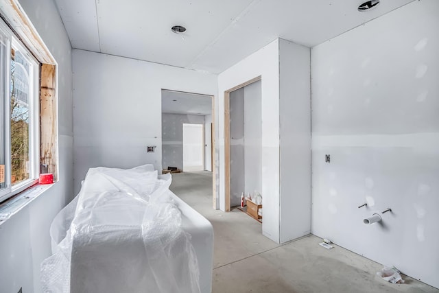bedroom with concrete floors