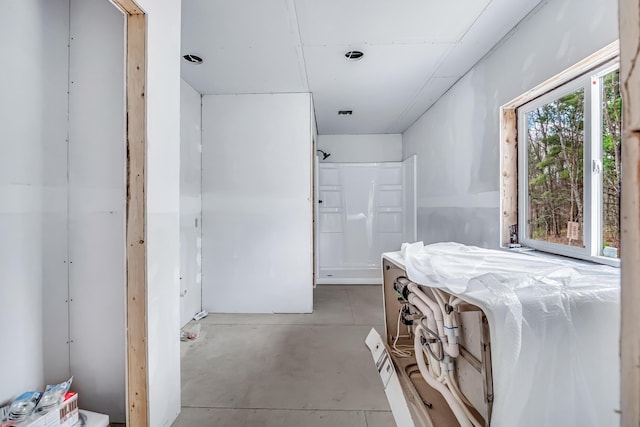 bathroom with concrete flooring