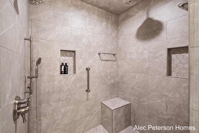 bathroom with a tile shower