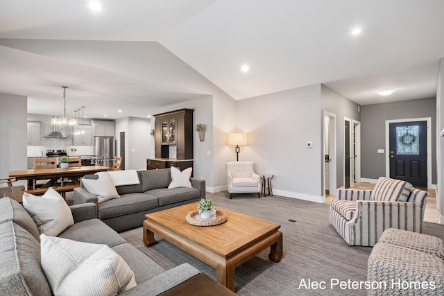living room with vaulted ceiling, baseboards, and recessed lighting