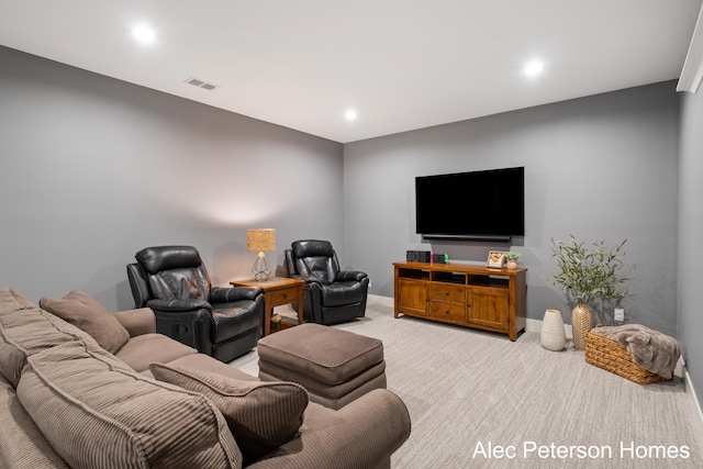 living room with light colored carpet, recessed lighting, and baseboards