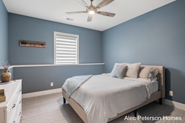 bedroom featuring light colored carpet, baseboards, and ceiling fan