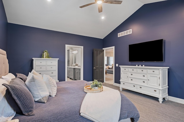 carpeted bedroom with baseboards, high vaulted ceiling, connected bathroom, and a ceiling fan
