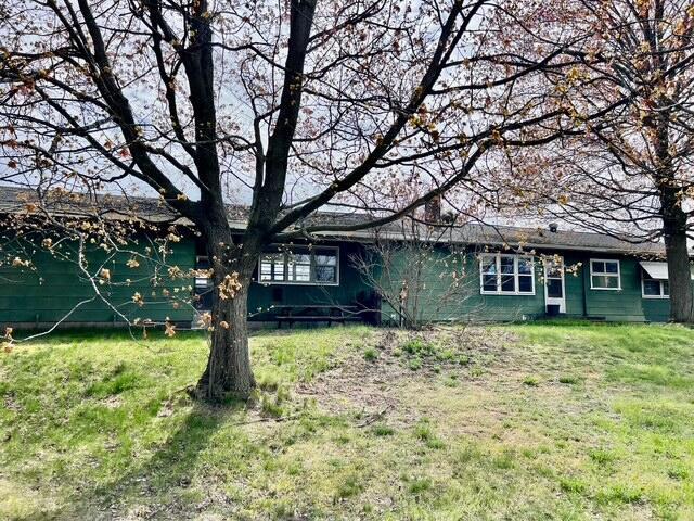 view of front of home with a front yard