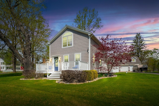 view of front of property featuring a deck and a front lawn
