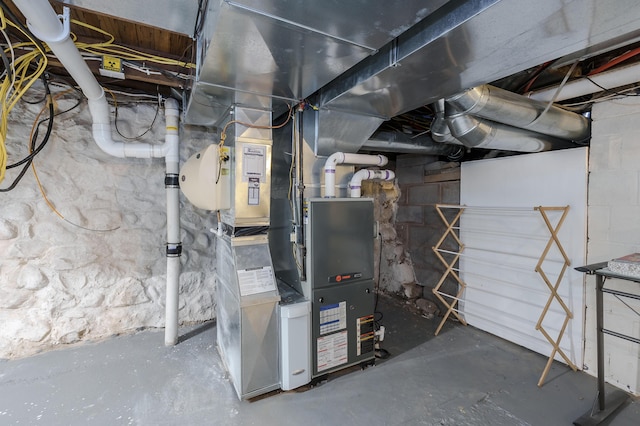 utility room with heating unit