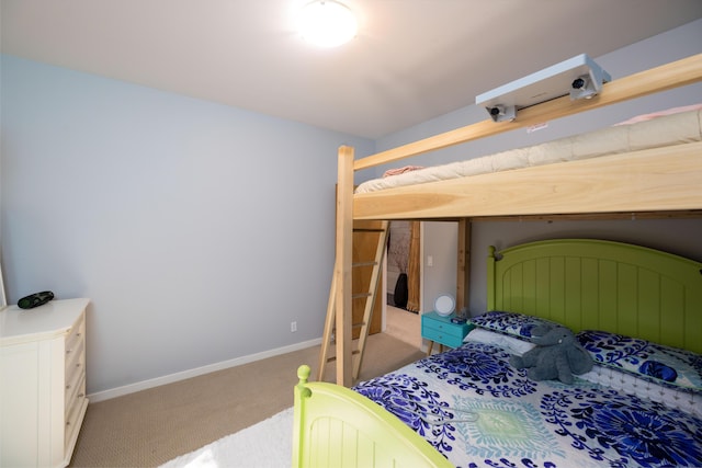 carpeted bedroom with baseboards