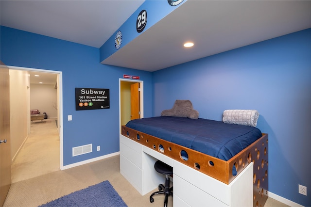 carpeted bedroom featuring baseboards and recessed lighting