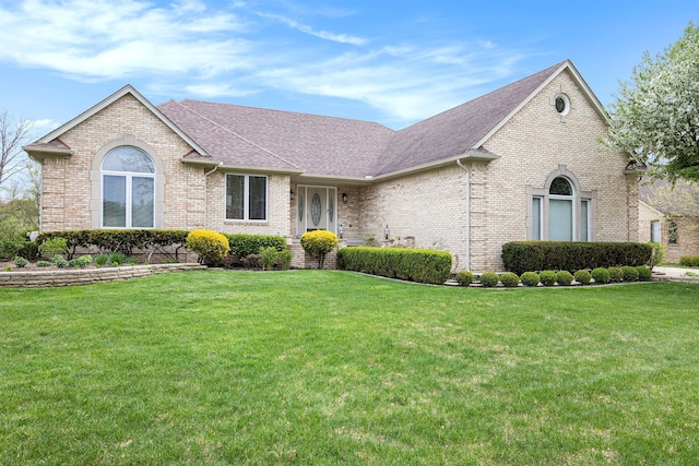 1204 Bradbury Dr, Troy, MI 48098 - view of front facade with brick siding, roof with shingles, and a front lawn