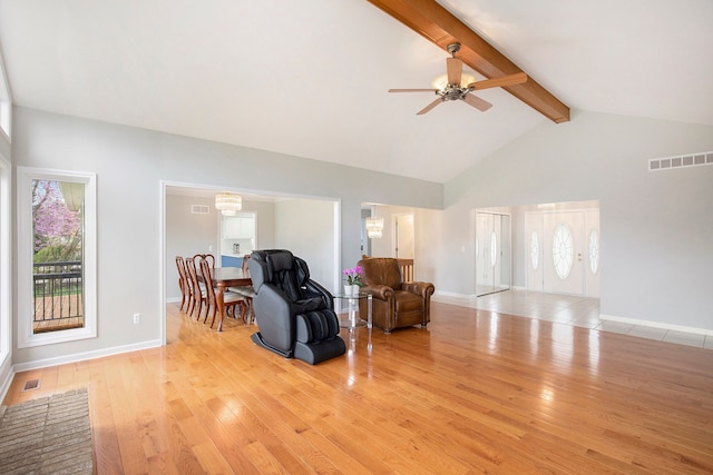 1204 Bradbury Dr, Troy, MI 48098 - living area with beamed ceiling, light wood-type flooring, a ceiling fan, high vaulted ceiling, and baseboards
