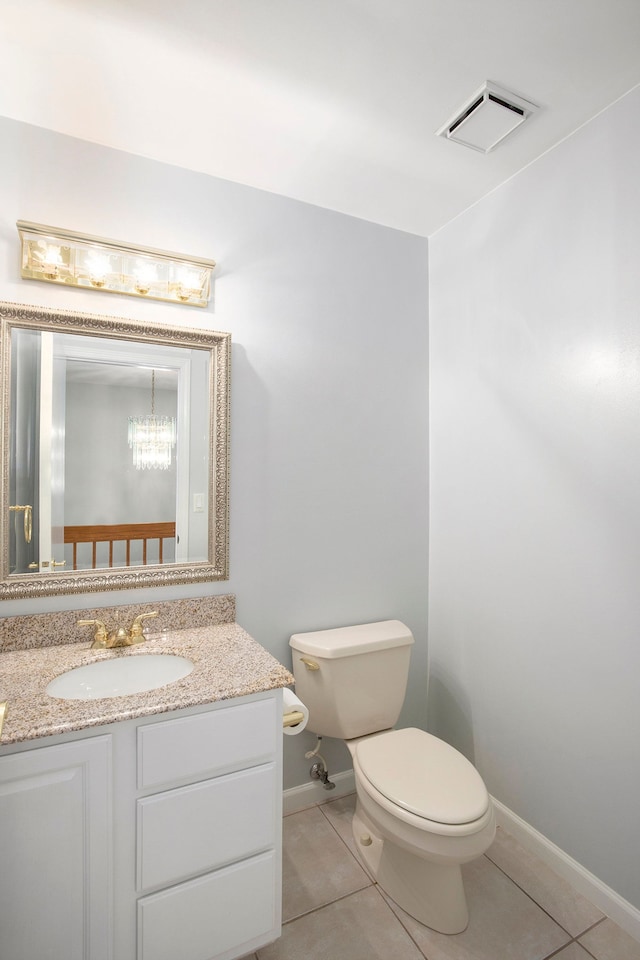 1204 Bradbury Dr, Troy, MI 48098 - bathroom featuring tile patterned floors, toilet, vanity, and baseboards
