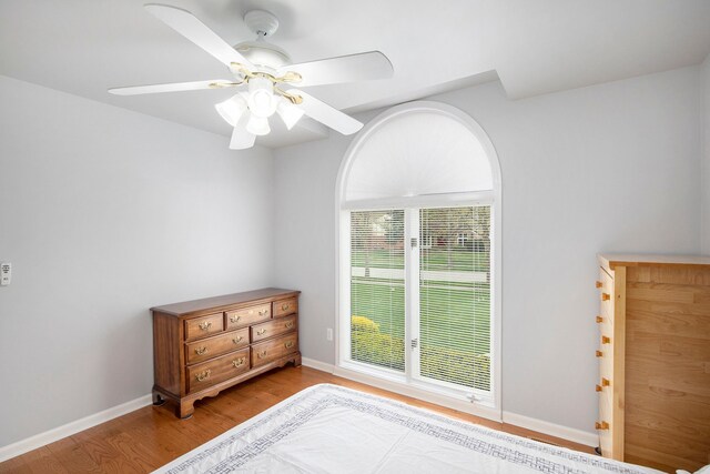 1204 Bradbury Dr, Troy, MI 48098 - bedroom with light wood-style floors, baseboards, and a ceiling fan