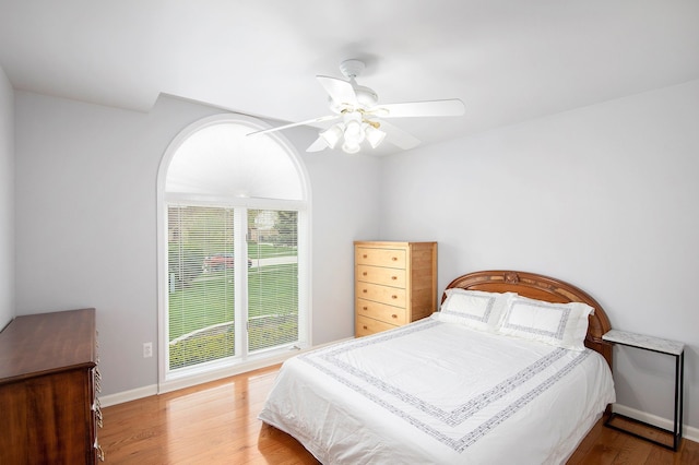 1204 Bradbury Dr, Troy, MI 48098 - bedroom featuring wood finished floors, baseboards, and a ceiling fan
