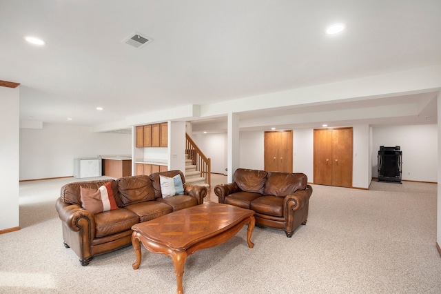 1204 Bradbury Dr, Troy, MI 48098 - living area with light carpet, recessed lighting, stairway, and baseboards