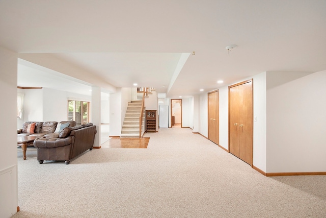 1204 Bradbury Dr, Troy, MI 48098 - living room featuring light carpet, stairway, recessed lighting, and baseboards