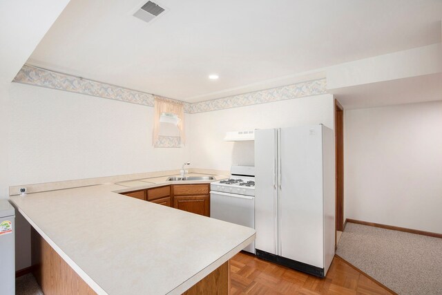 1204 Bradbury Dr, Troy, MI 48098 - kitchen featuring white appliances, a sink, under cabinet range hood, a peninsula, and light countertops