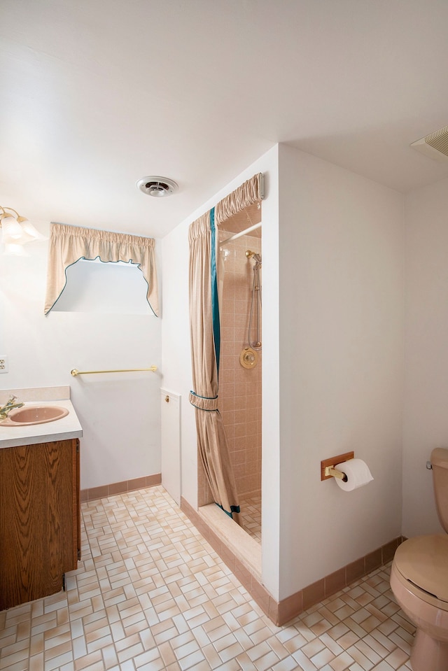 1204 Bradbury Dr, Troy, MI 48098 - bathroom with toilet, a stall shower, vanity, and baseboards