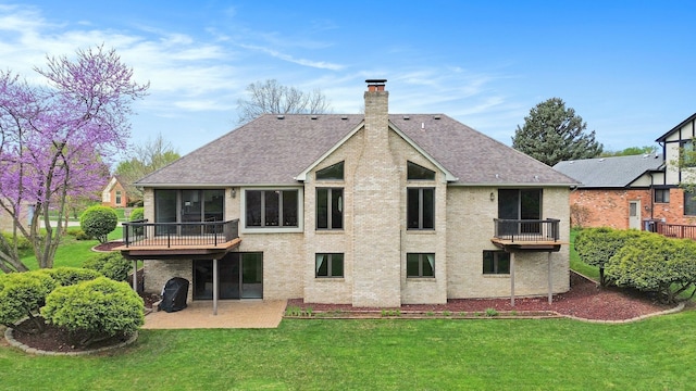 1204 Bradbury Dr, Troy, MI 48098 - back of house with a chimney, a lawn, a sunroom, and a patio
