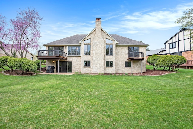 1204 Bradbury Dr, Troy, MI 48098 - back of house featuring a balcony, a chimney, a lawn, and roof with shingles