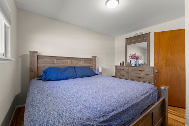 bedroom featuring wood finished floors