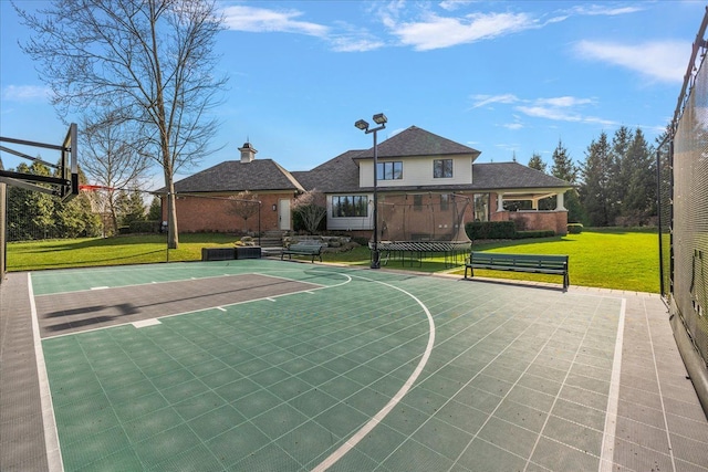 view of sport court featuring community basketball court and a yard